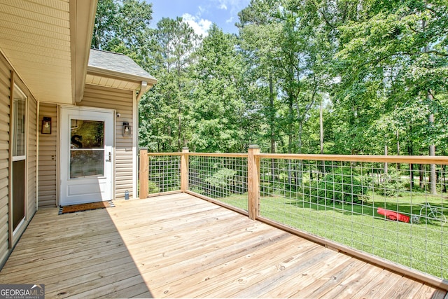 351 Weldon Rd, Palmetto, GA 30268 - wooden deck featuring a yard and view of wooded area