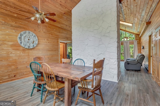 351 Weldon Rd, Palmetto, GA 30268 - dining room with wooden ceiling, high vaulted ceiling, wood walls, wood finished floors, and ceiling fan