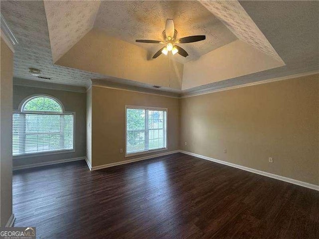 4189 Duncan Ives Dr, Buford, GA 30519 - empty room with a tray ceiling, dark wood-style floors, a ceiling fan, ornamental molding, and a textured ceiling