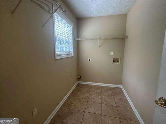 4189 Duncan Ives Dr, Buford, GA 30519 - laundry area with hookup for an electric dryer, washer hookup, and tile patterned flooring