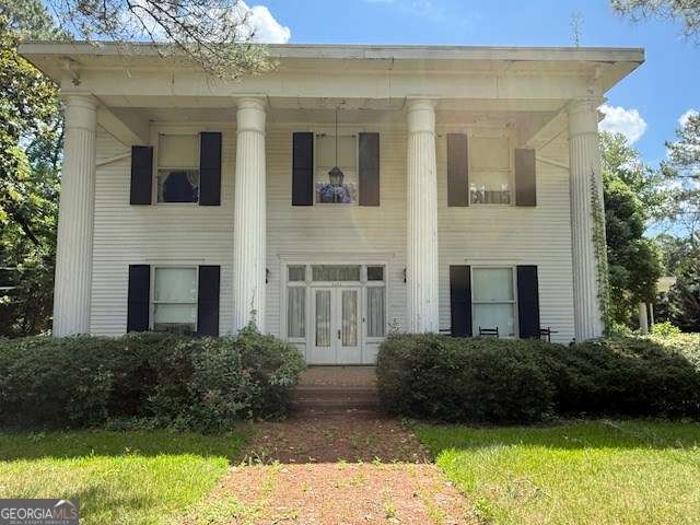 2205 Wilson Ave, Tifton, GA 31794 - view of front facade with french doors and a front yard