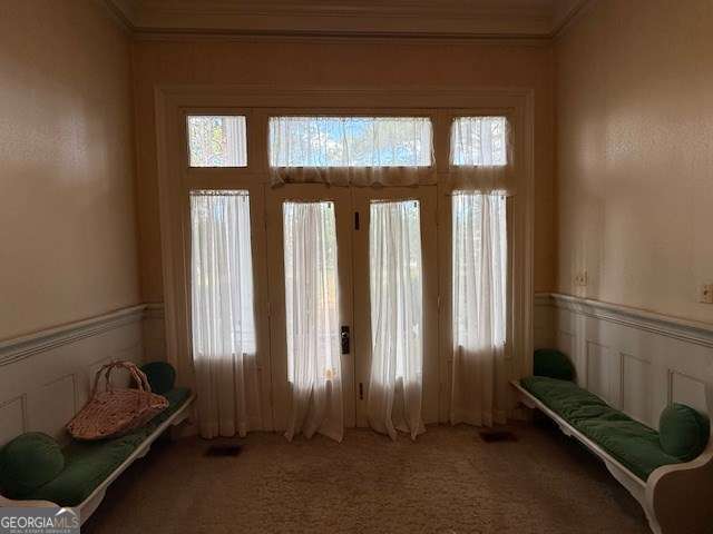 2205 Wilson Ave, Tifton, GA 31794 - carpeted foyer with crown molding and wainscoting