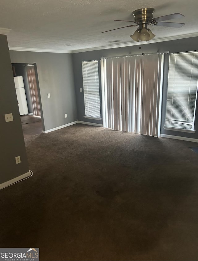 6470 Bedford Ln, Lithonia, GA 30058 - unfurnished room featuring dark colored carpet, a ceiling fan, and ornamental molding