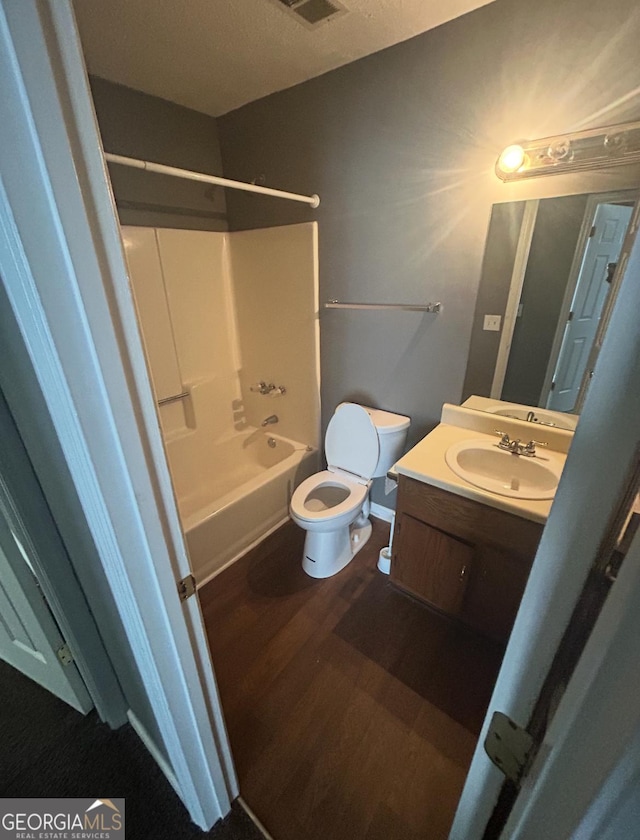6470 Bedford Ln, Lithonia, GA 30058 - full bath with vanity, wood finished floors, and shower / tub combination