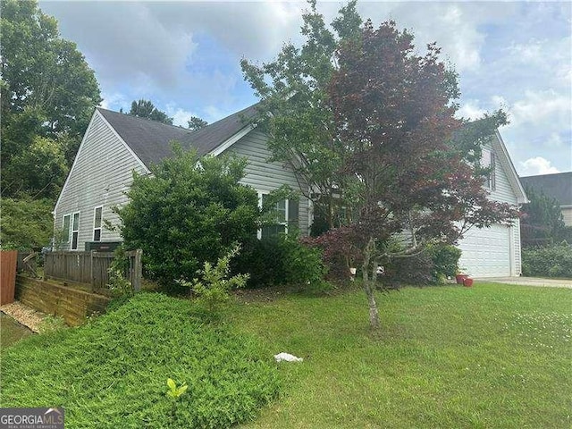 1241 Key Manor Ln, Lawrenceville, GA 30045 - view of property exterior featuring an attached garage and driveway