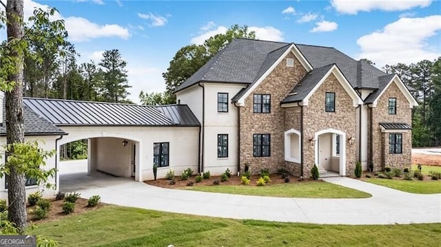 15792 Thompson Rd, Milton, GA 30004 - french country inspired facade with a standing seam roof, a front yard, stucco siding, and stone siding