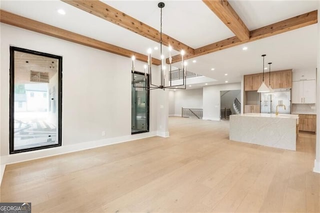 15792 Thompson Rd, Milton, GA 30004 - unfurnished living room with beamed ceiling, light wood-style flooring, recessed lighting, and a chandelier