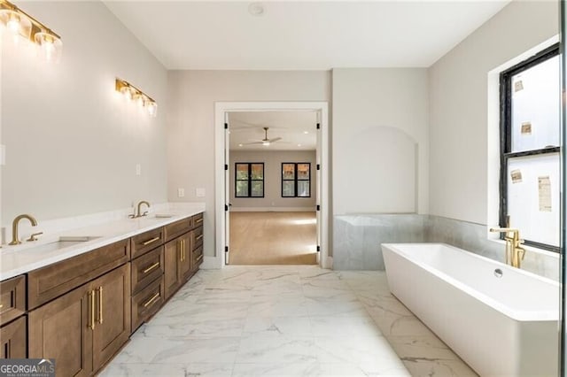 15792 Thompson Rd, Milton, GA 30004 - full bathroom with a freestanding tub, ceiling fan, double vanity, and marble finish flooring