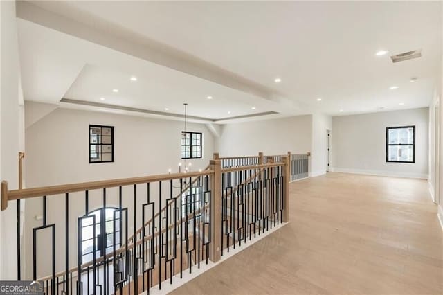15792 Thompson Rd, Milton, GA 30004 - hall with an upstairs landing, wood finished floors, a raised ceiling, and recessed lighting