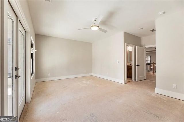 15792 Thompson Rd, Milton, GA 30004 - unfurnished bedroom featuring concrete floors and a ceiling fan