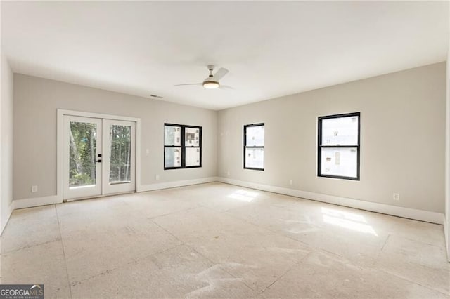15792 Thompson Rd, Milton, GA 30004 - empty room with french doors and a ceiling fan