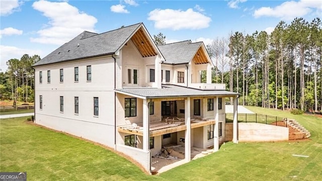 15792 Thompson Rd, Milton, GA 30004 - rear view of house with stucco siding, a lawn, a patio, and roof with shingles