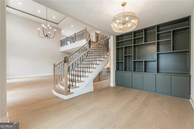 15792 Thompson Rd, Milton, GA 30004 - stairway with a chandelier, wood finished floors, and recessed lighting