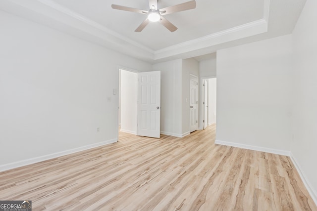 384 Daniel Mill Xing, Villa Rica, GA 30180 - empty room with wood finished floors, a tray ceiling, a ceiling fan, and crown molding