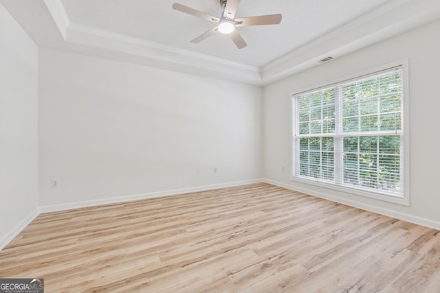 384 Daniel Mill Xing, Villa Rica, GA 30180 - empty room with a raised ceiling, ornamental molding, light wood-type flooring, and ceiling fan