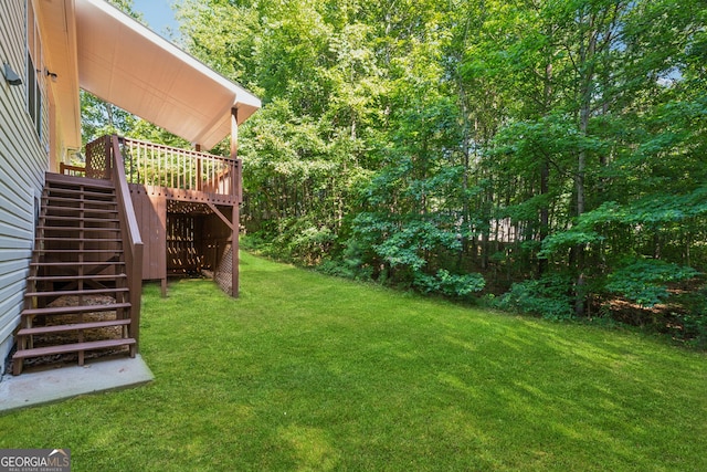 384 Daniel Mill Xing, Villa Rica, GA 30180 - view of grassy yard with stairs and a deck