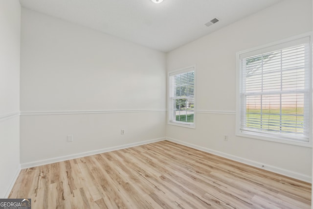 384 Daniel Mill Xing, Villa Rica, GA 30180 - empty room featuring wood finished floors and baseboards