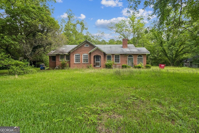 1494 Jeffersonville Rd, Macon, GA 31217 - ranch-style house with a chimney and brick siding