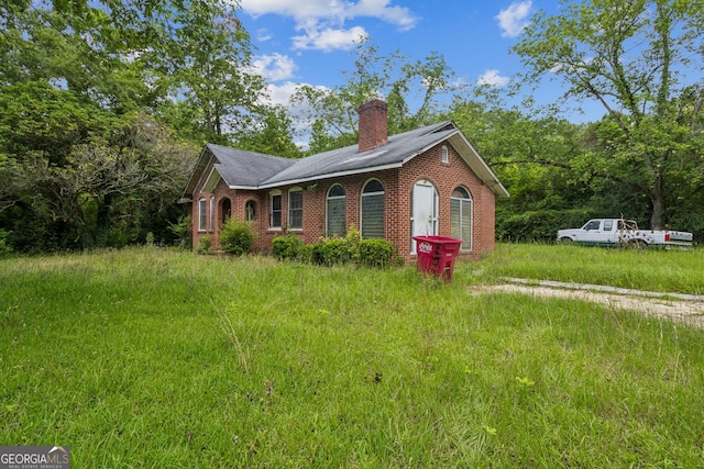 1494 Jeffersonville Rd, Macon, GA 31217 - view of front of home featuring a chimney and brick siding