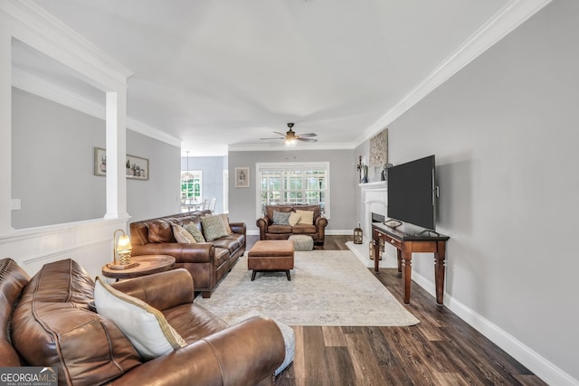 106 Big Cotton Trl, Mcdonough, GA 30252 - living area with crown molding, dark wood-type flooring, ceiling fan, and a fireplace