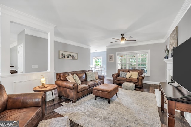 106 Big Cotton Trl, Mcdonough, GA 30252 - living area with dark wood-style flooring, a ceiling fan, ornamental molding, and a fireplace
