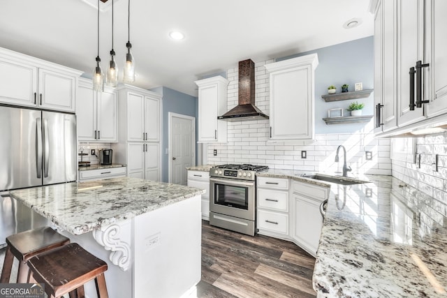 106 Big Cotton Trl, Mcdonough, GA 30252 - kitchen featuring stainless steel appliances, wall chimney range hood, backsplash, open shelves, and a kitchen breakfast bar