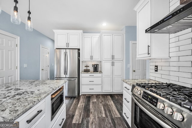 106 Big Cotton Trl, Mcdonough, GA 30252 - kitchen featuring appliances with stainless steel finishes, wall chimney exhaust hood, decorative backsplash, white cabinetry, and recessed lighting