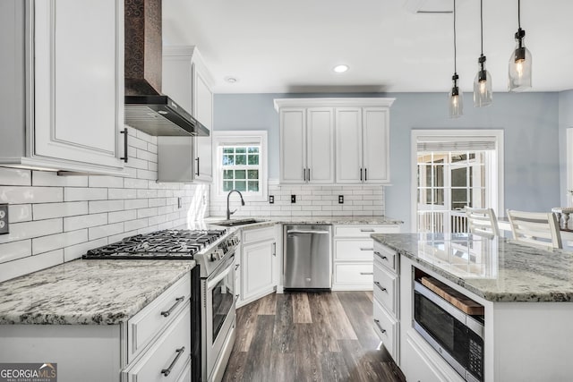 106 Big Cotton Trl, Mcdonough, GA 30252 - kitchen featuring stainless steel appliances, wall chimney range hood, white cabinetry, and recessed lighting