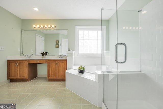 106 Big Cotton Trl, Mcdonough, GA 30252 - bathroom featuring a stall shower, double vanity, tile patterned flooring, and a garden tub