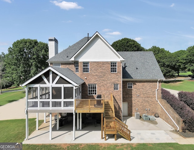106 Big Cotton Trl, Mcdonough, GA 30252 - rear view of house featuring a patio, a sunroom, stairway, a deck, and roof with shingles