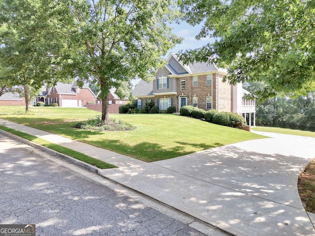 106 Big Cotton Trl, Mcdonough, GA 30252 - traditional-style home featuring a front lawn and brick siding