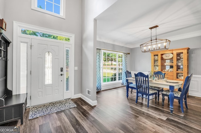 106 Big Cotton Trl, Mcdonough, GA 30252 - entryway with dark wood finished floors, a chandelier, and crown molding