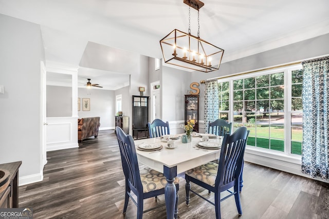 106 Big Cotton Trl, Mcdonough, GA 30252 - dining room with ornamental molding, dark wood-type flooring, ceiling fan, a chandelier, and a wainscoted wall