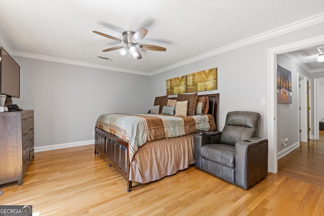 2421 Pittman Cir, Cumming, GA 30040 - bedroom with light wood-style flooring, ornamental molding, and ceiling fan