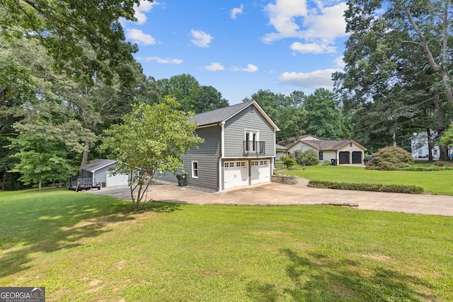 2421 Pittman Cir, Cumming, GA 30040 - view of property exterior with driveway, an attached garage, a yard, and view of scattered trees