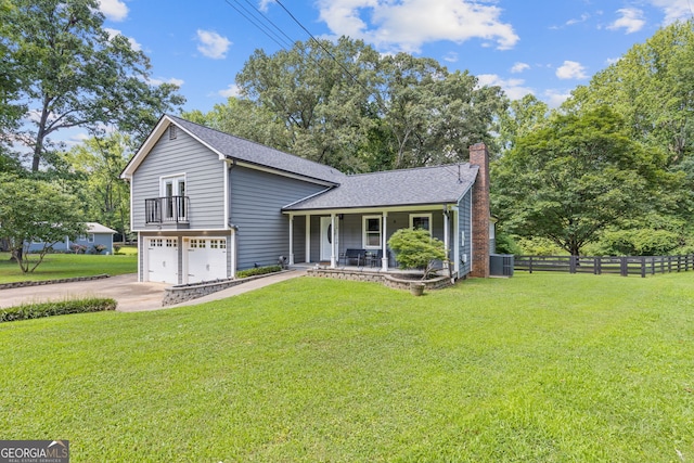 2421 Pittman Cir, Cumming, GA 30040 - split level home featuring a porch, driveway, an attached garage, a chimney, and a shingled roof