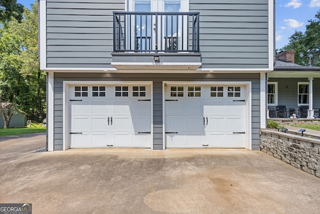 2421 Pittman Cir, Cumming, GA 30040 - garage featuring a porch