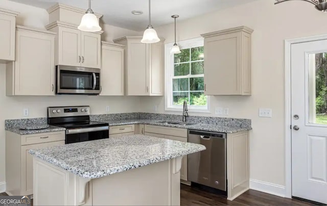 0 Nocona Trl, Ellijay, GA 30536 - kitchen with appliances with stainless steel finishes, dark wood-style flooring, light stone countertops, a kitchen island, and recessed lighting