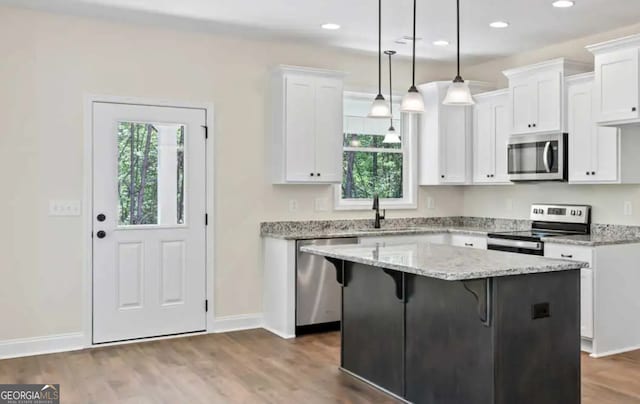 0 Nocona Trl, Ellijay, GA 30536 - kitchen featuring appliances with stainless steel finishes, plenty of natural light, white cabinets, recessed lighting, and dark wood finished floors