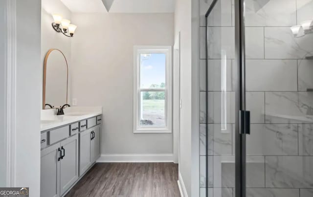 0 Nocona Trl, Ellijay, GA 30536 - bathroom featuring vanity, a stall shower, and wood finished floors