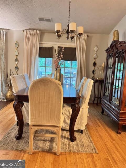 791 Bristol Way, Lithonia, GA 30058 - dining space featuring a chandelier and wood-type flooring