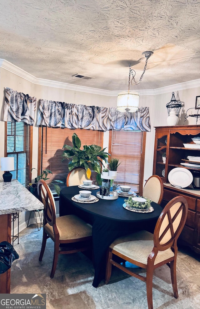 791 Bristol Way, Lithonia, GA 30058 - dining area featuring ornamental molding and a textured ceiling
