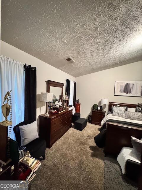 791 Bristol Way, Lithonia, GA 30058 - carpeted bedroom featuring lofted ceiling and a textured ceiling