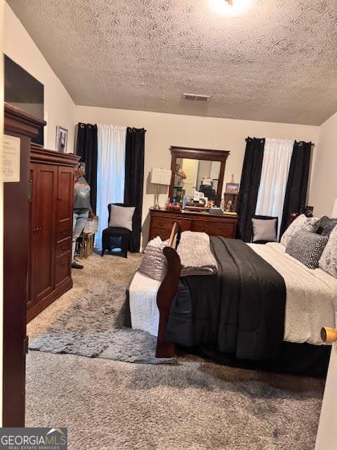 791 Bristol Way, Lithonia, GA 30058 - carpeted bedroom with a textured ceiling and vaulted ceiling