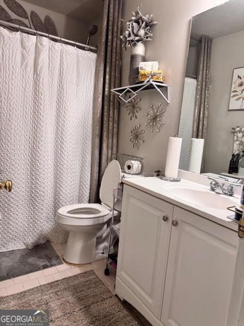 791 Bristol Way, Lithonia, GA 30058 - bathroom featuring vanity, tile patterned floors, and curtained shower
