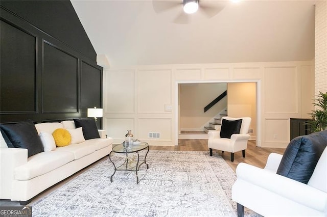 300 Saddle Creek Ln, Roswell, GA 30076 - living area with a decorative wall, stairs, ceiling fan, and light wood-style flooring