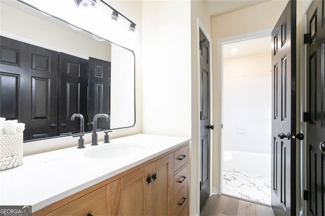 300 Saddle Creek Ln, Roswell, GA 30076 - full bath featuring vanity, wood finished floors, a shower, and a tub to relax in