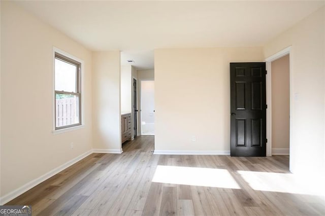 300 Saddle Creek Ln, Roswell, GA 30076 - spare room featuring light wood-style flooring and baseboards