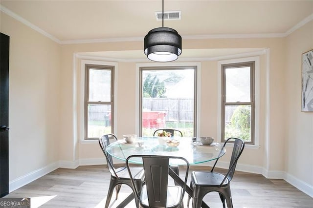 300 Saddle Creek Ln, Roswell, GA 30076 - dining room with light wood-style floors, plenty of natural light, and ornamental molding