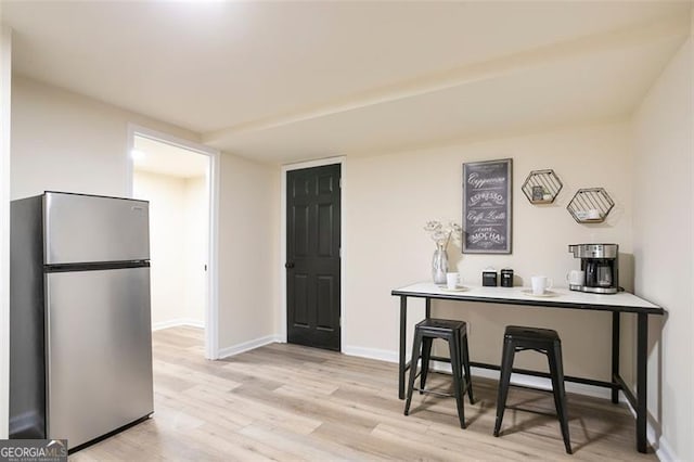 300 Saddle Creek Ln, Roswell, GA 30076 - kitchen featuring freestanding refrigerator and light wood-style floors